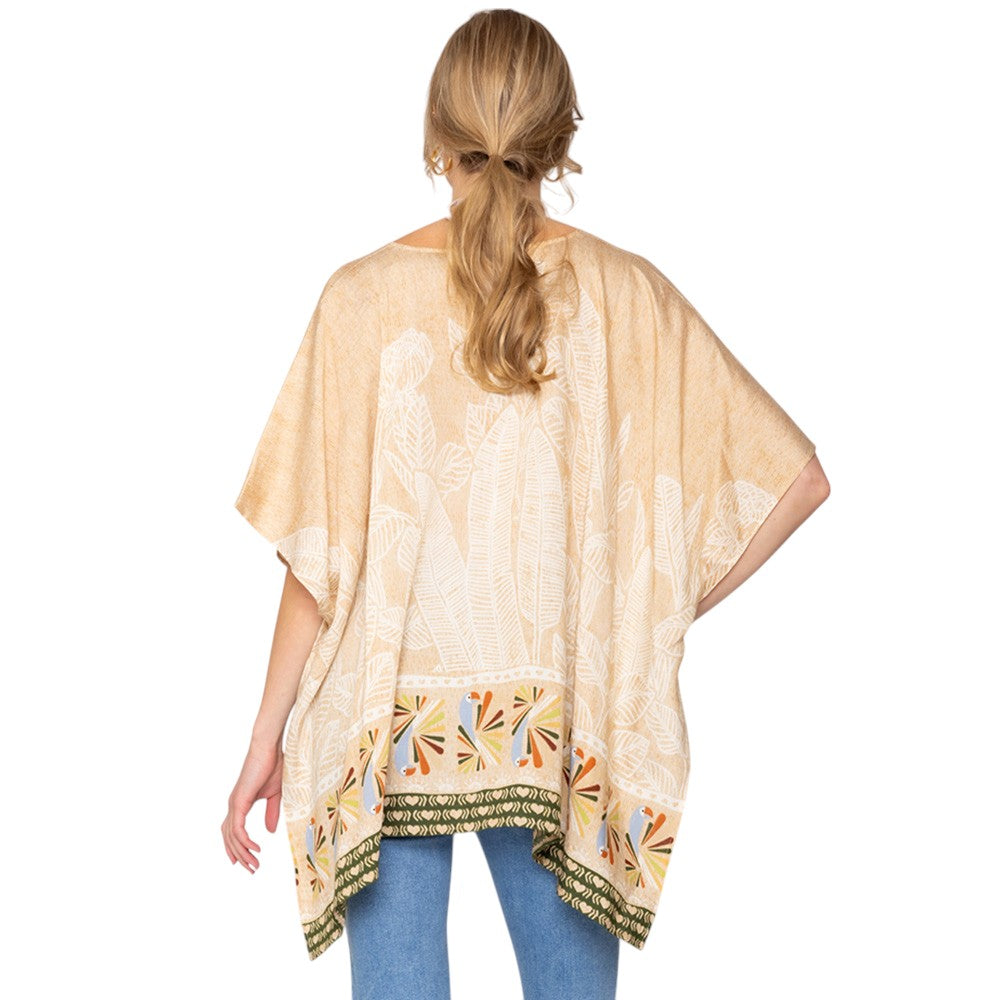 Tan Leaf Print Cover Up Poncho is the perfect addition to your summer wardrobe. Made from lightweight fabric, it is both stylish and functional, providing coverage from the sun while keeping you cool. The leaf print adds a touch of nature-inspired elegance to any beach or pool ensemble. 