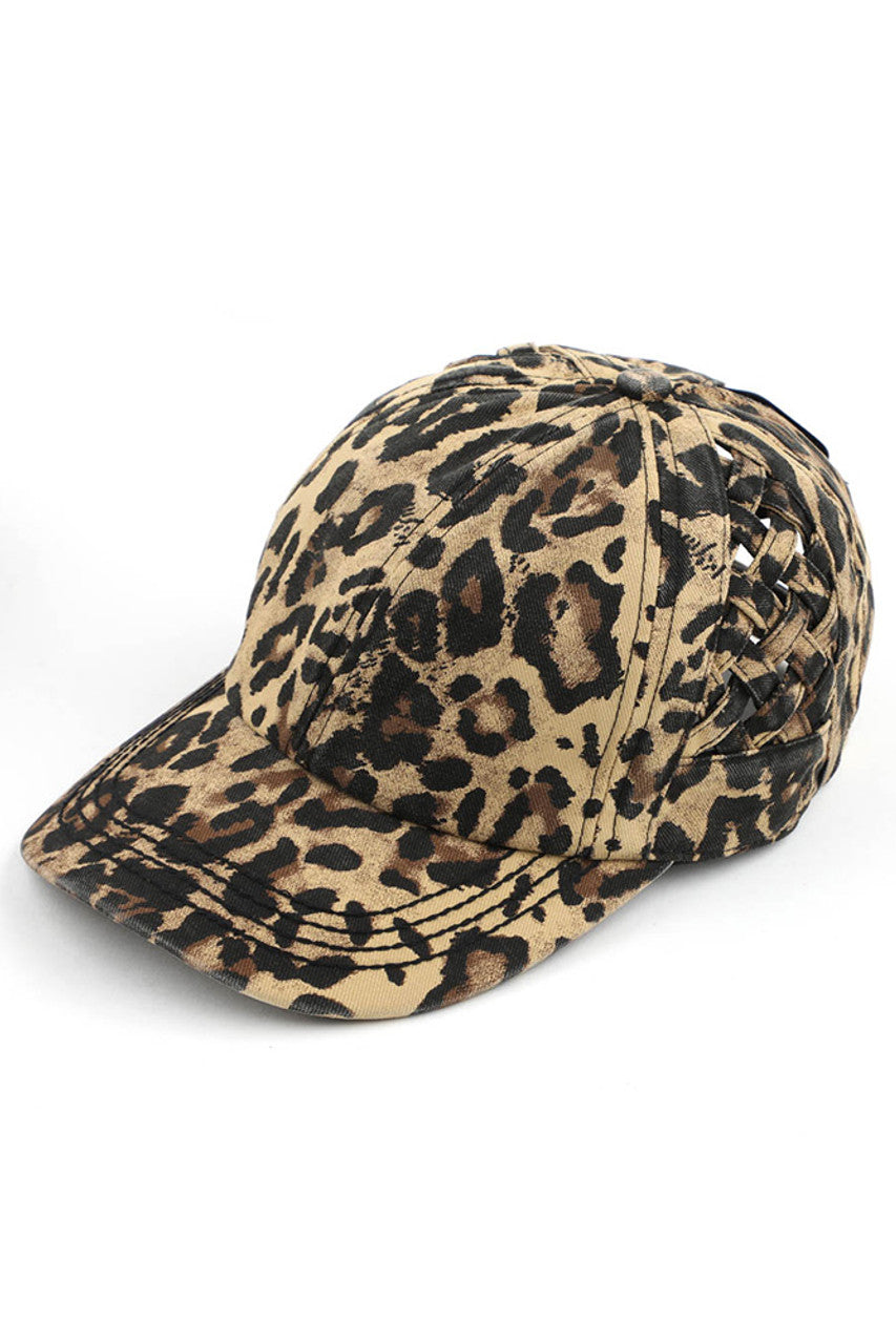 Leopard C.C WEAVON BASKET CRISS-CROSS PONYCAP is a stylish and functional accessory for any outfit. Made with high-quality materials, this cap features a unique criss-cross design, providing both style and comfort. Stay protected from the sun while looking your best with this trendy ponycap.