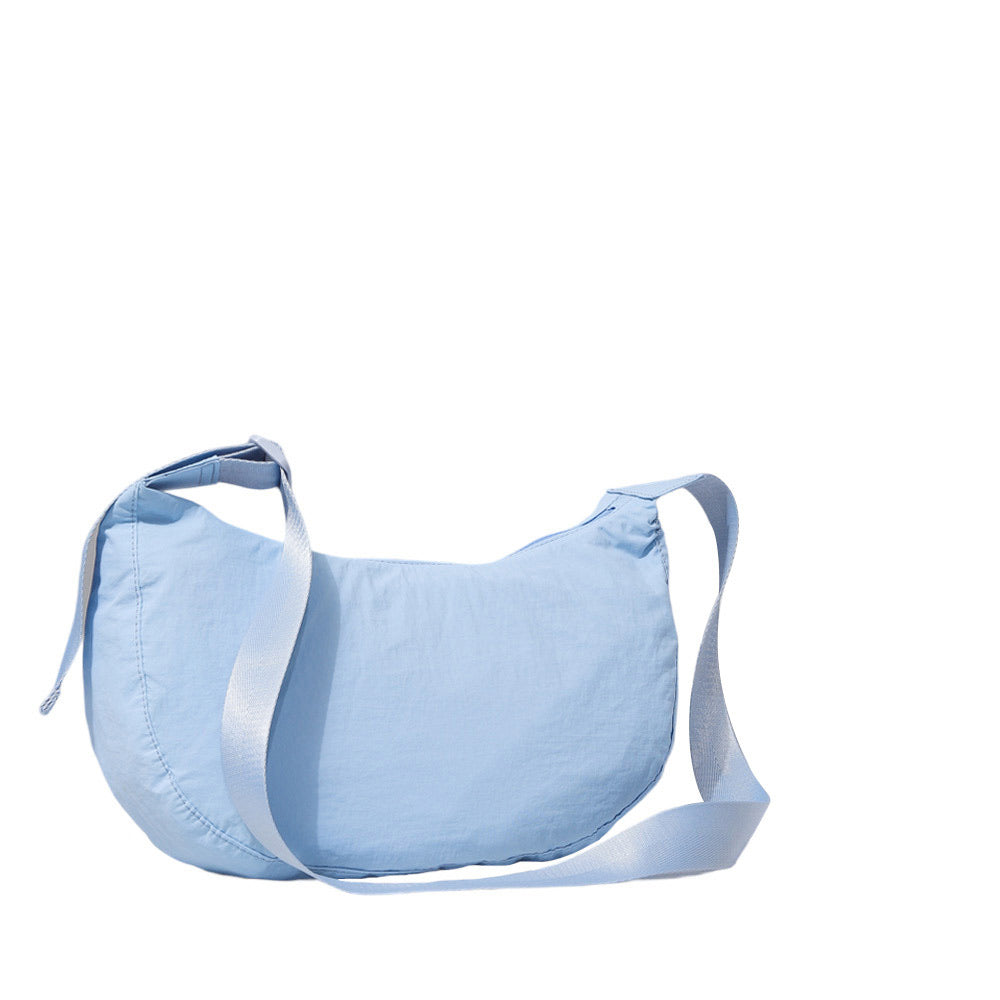 Light Blue Solid Nylon Sling Bag Crossbody Bag, is perfect to carry all your handy items with ease. This handbag features a top zipper closure for security that makes your life easier and trendier. This is the perfect gift idea for a birthday, holiday, Christmas, anniversary, Valentine's Day, etc.