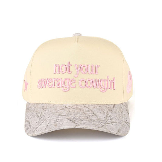 Light Pink CC Beanie “Not Your Average Cowgirl” Lettering Two-Tone Trucker Baseball Snapback Cap features bold embroidered lettering with a stylish two-tone design for a standout western-inspired look. The classic trucker silhouette with a snapback closure provides breathable comfort and an adjustable fit for all-day wear.