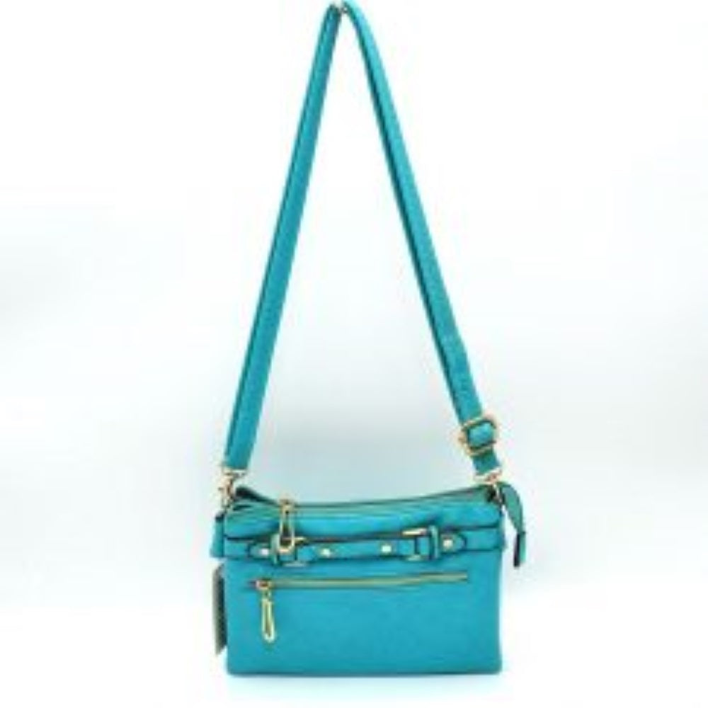 Light Blue This functional crossbody bag is designed for organized everyday use, featuring a textured exterior equipped with multiple secure storage compartments. The front panel includes a convenient horizontal zippered pocket accented with an oversized metallic zipper pull, situated beneath a decorative horizontal band detailed with metallic studs and loops.