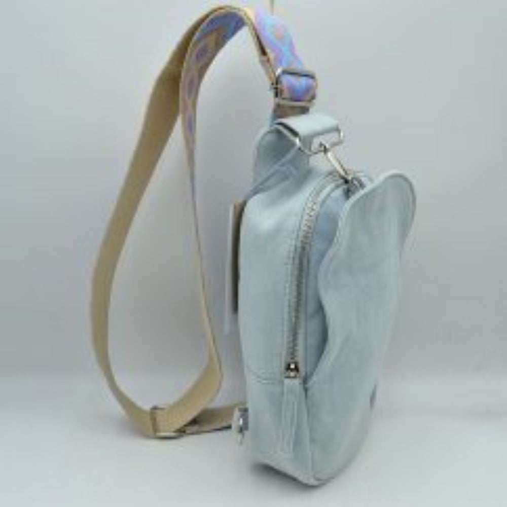 Light Denim This functional sling bag features a structured silhouette with multiple storage compartments, including a secure zippered main section and an integrated front pocket for easy access to essentials. Perfect for everyday hands-free use, the bag is equipped with a wide, adjustable shoulder strap showcasing an intricate geometric woven pattern. Durable metal hardware and secure clasps connect the strap to the body of the bag, combining practical utility with a casual, modern design.