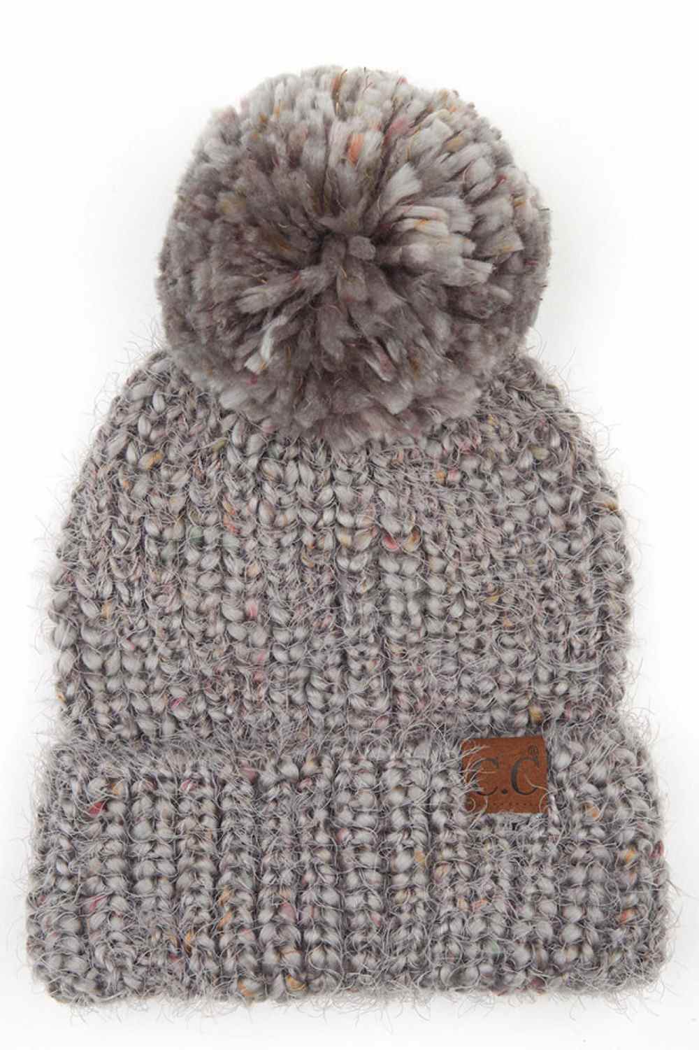 Gray The C.C Multicolor Feather Yarn Beanie with Pom is a cozy, stylish knit hat featuring vibrant, multicolored yarn and a playful pom-pom on top. Perfect for adding a pop of color to your winter wardrobe while keeping you warm and comfortable.