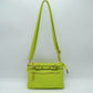 Light Green This functional crossbody bag is designed for organized everyday use, featuring a textured exterior equipped with multiple secure storage compartments. The front panel includes a convenient horizontal zippered pocket accented with an oversized metallic zipper pull, situated beneath a decorative horizontal band detailed with metallic studs and loops.