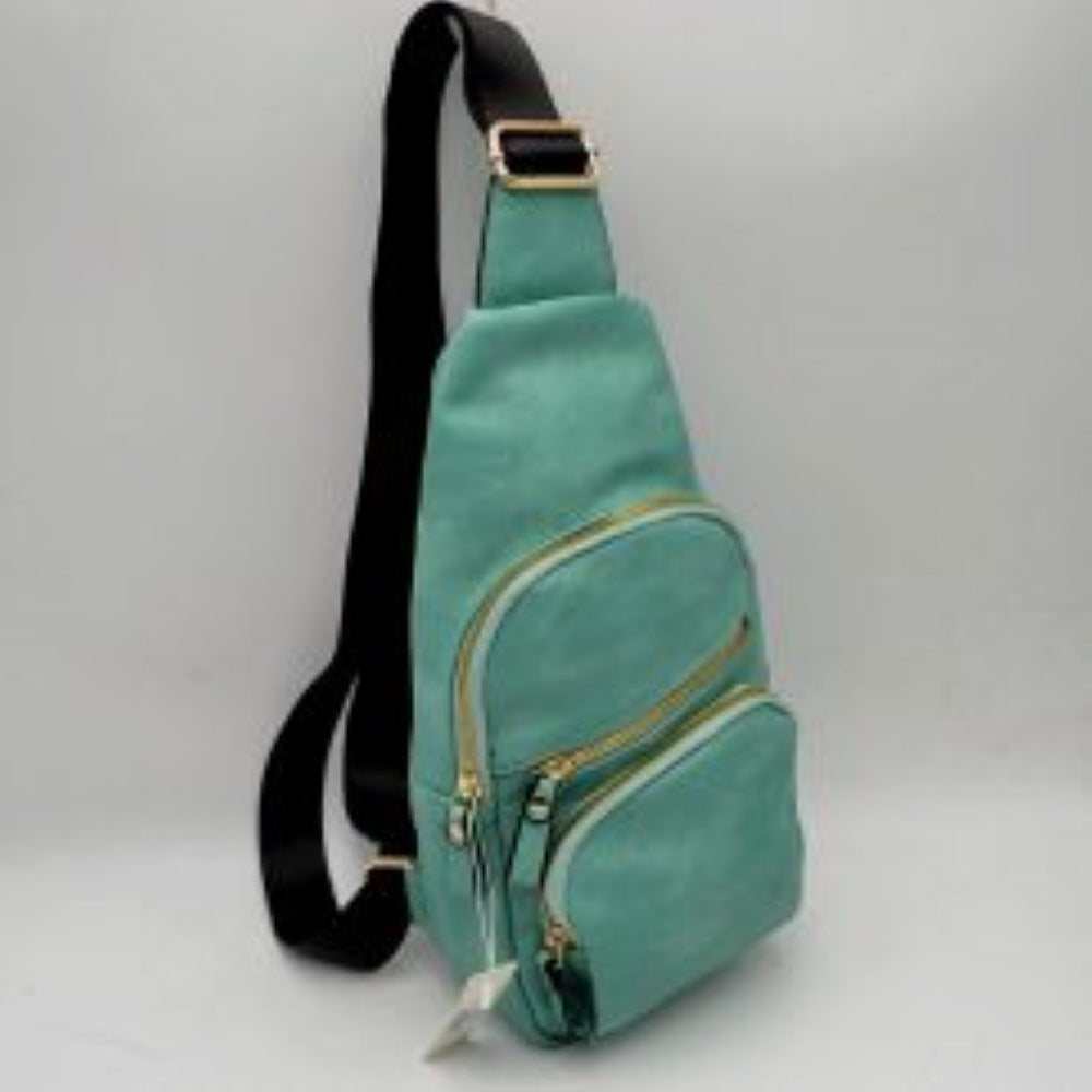 Light This functional sling bag features a contoured silhouette tailored for comfortable everyday use & hands-free convenience. It offers organized storage compartments, including a spacious main section & two smaller stacked front pockets, all secured by metallic zippers equipped w/ matching pull tabs. A long, adjustable shoulder strap w/ a built-in slide buckle allows for customizable carrying across the body, making it a practical accessory for keeping your daily essentials securely within reach.