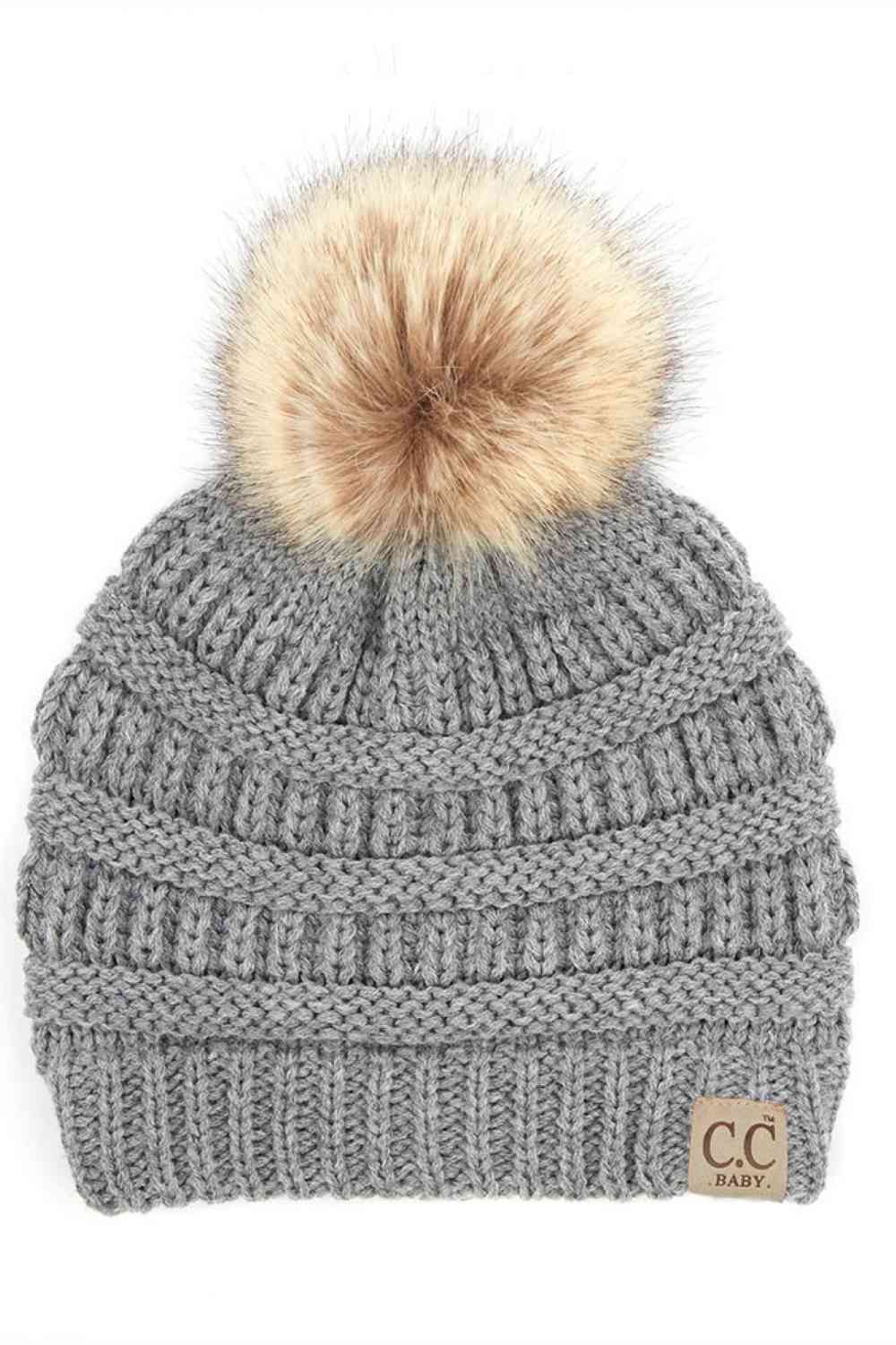 Light Gray Keep your little one warm and cozy with this C.C Solid Ribbed Infant Beanie. Made from 100% acrylic, the soft ribbed knit construction provides gentle comfort against delicate skin while the natural fur pom adds a charming detail.