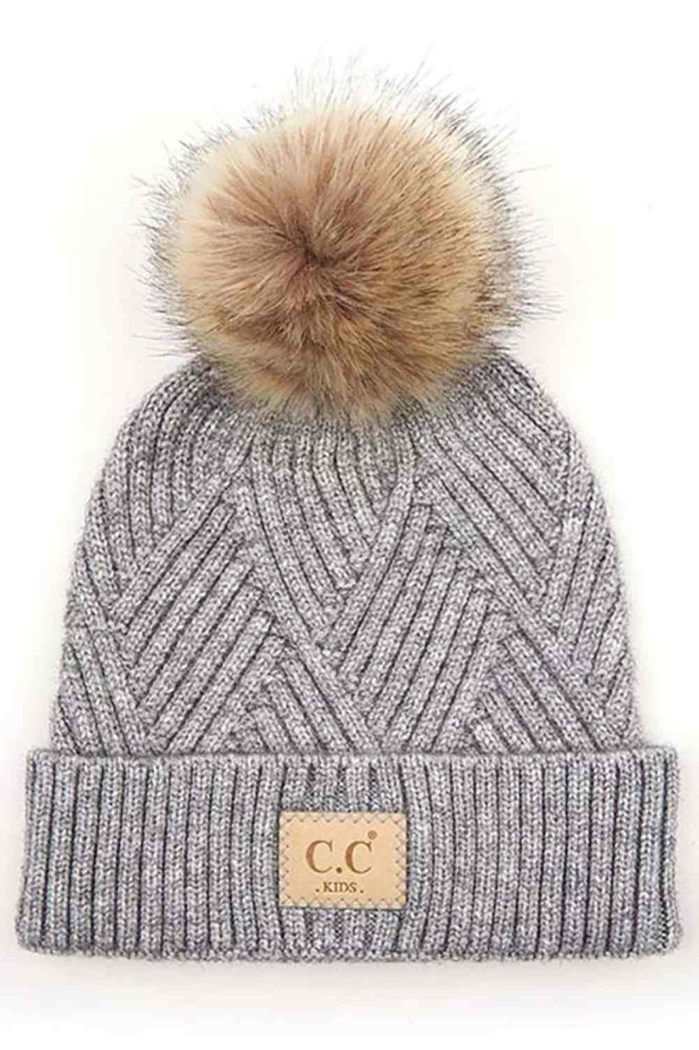 Light Gray Keep your little one cozy with this C.C Kids Knit Beanie, featuring a playful diagonal stripes criss-cross pattern. Crafted from a soft blend of 47% rayon, 31% PBT, and 22% nylon, this beanie offers warmth and durability for everyday wear.