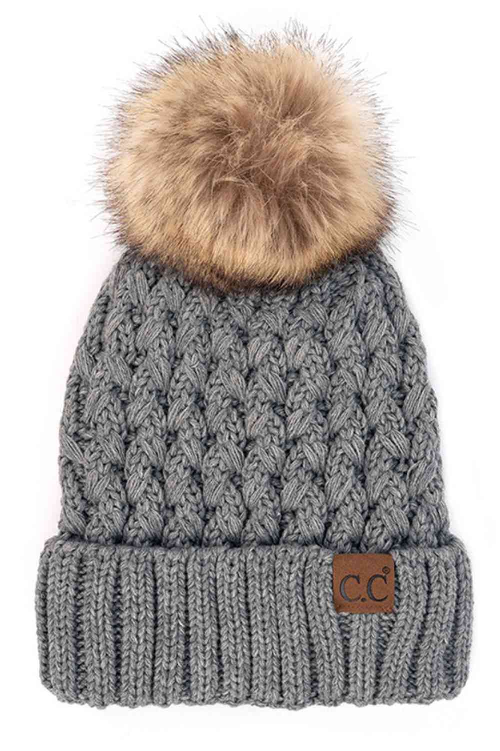 Gray Elevate your winter wardrobe with the C.C Lattice Crossover Stitch Beanie, featuring an intricate lattice pattern and cozy pom detail. Crafted from 100% soft acrylic, this beanie delivers warmth and comfort without the weight. The crossover stitch design adds visual interest while the relaxed fit suits most face shapes. Perfect for layering over your favorite winter looks, this versatile beanie transitions effortlessly from casual outings to outdoor adventures. One size fits most for easy, everyday wea