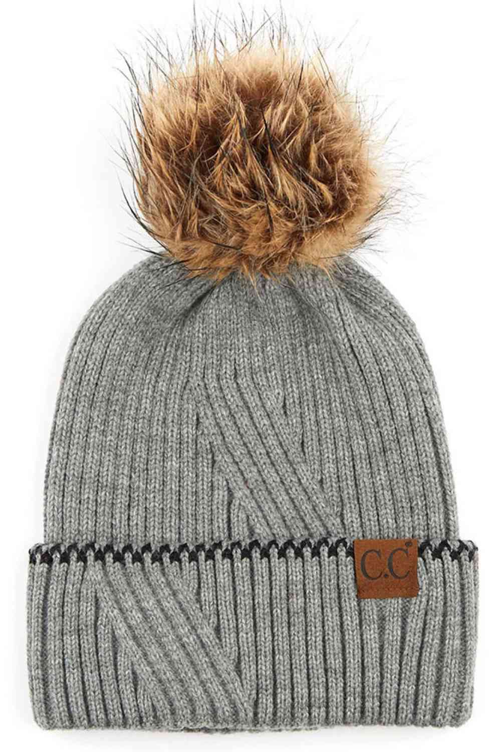 Light Gray C.C Solid Pom Beanie with Accented Cuff Stay warm and stylish with this classic C.C solid pom beanie, designed for everyday comfort. Made from 100% acrylic, this lightweight knit offers softness and durability through winter seasons.