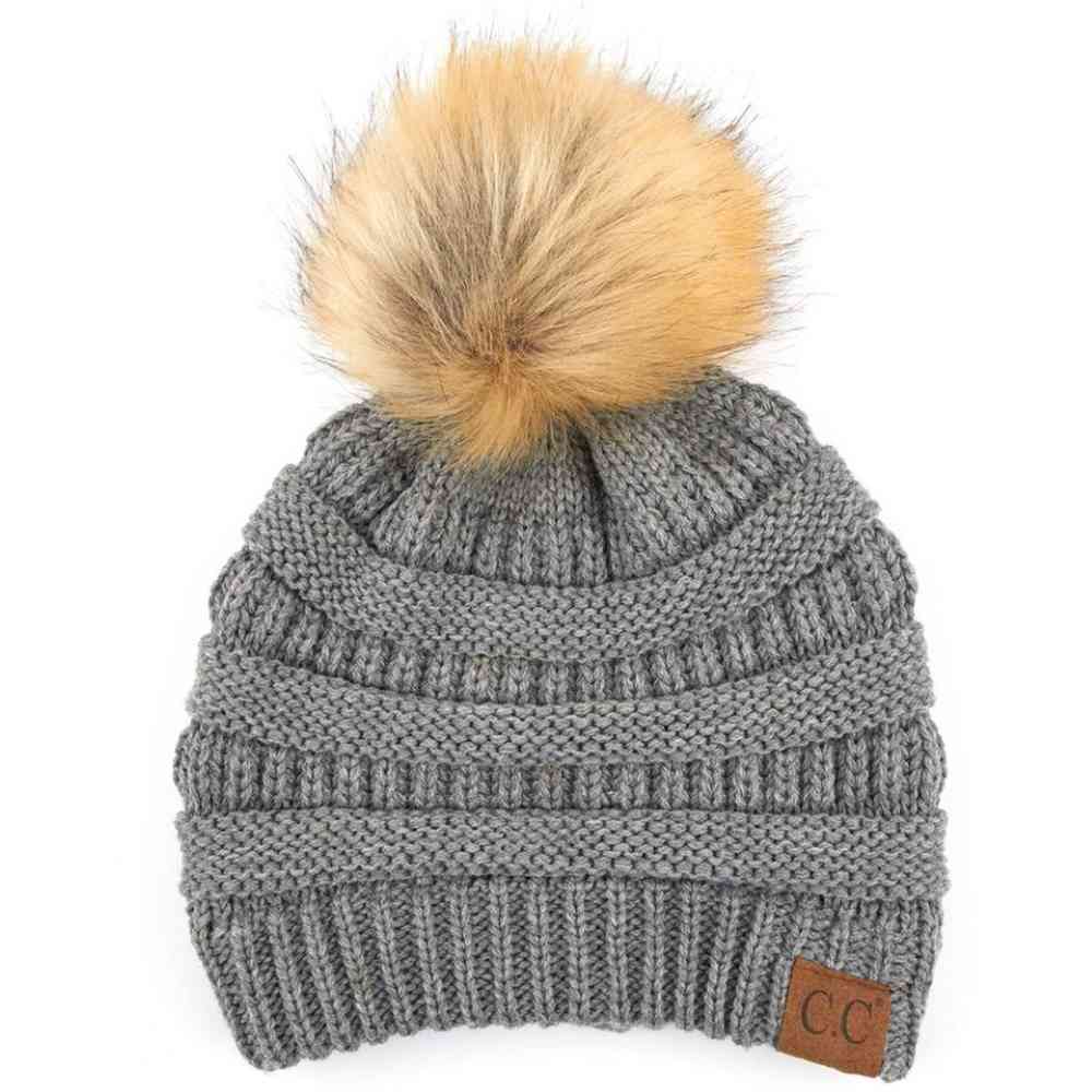 Light Grey Stay warm and cozy with this classic C.C Pom Pom Knit Beanie, crafted from 100% soft acrylic for all-day comfort. The ribbed knit design adds texture and durability, while the signature pom pom on top brings a playful touch to any winter outfit. One size fits most, making it the perfect accessory for everyone. Ideal for cold weather adventures or casual everyday wear.