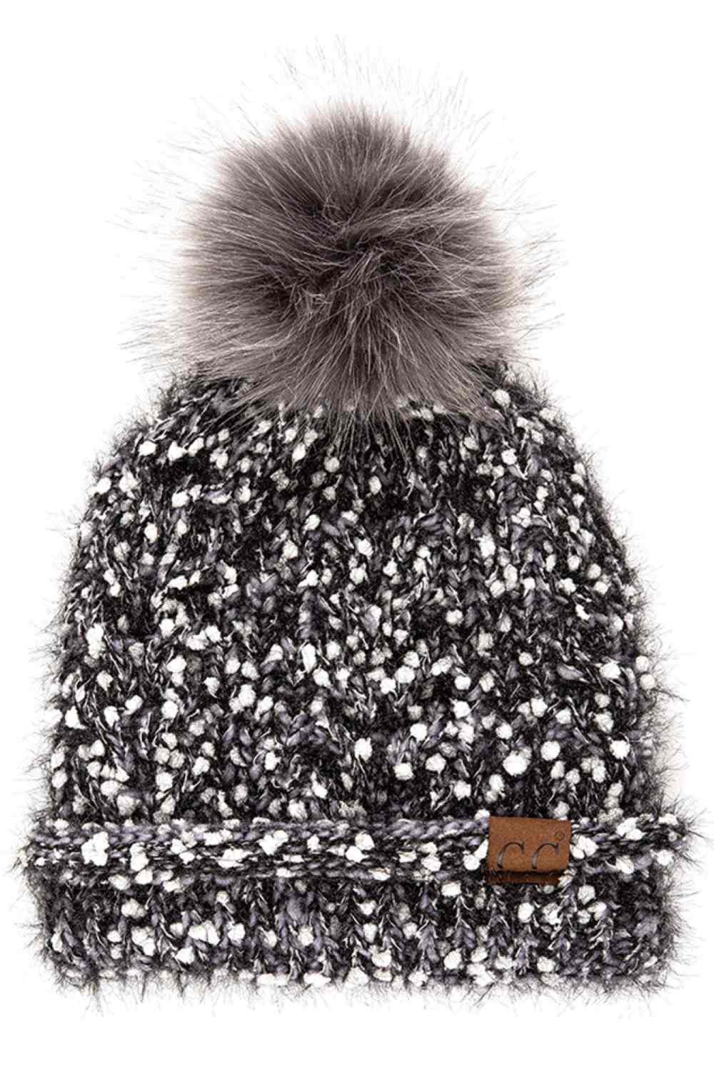 Grey The C.C Eyelash Confetti Yarn Knit Beanie with Pom features soft eyelash yarn blended with subtle confetti flecks for a fun, textured look. Topped with a fluffy pom-pom, it delivers cozy warmth and a playful sparkle perfect for cold-weather styling.