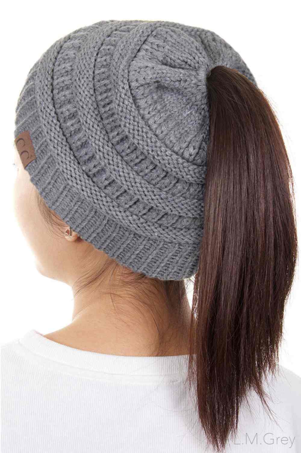 Light Grey The C.C Solid Color Ponytail Messy Bun Beanie combines comfort with versatility for effortless everyday style. Crafted from 100% soft acrylic, this beanie features an open crown design that accommodates ponytails and messy buns while keeping you warm. The one-size-fits-most construction ensures a secure, flattering fit for virtually anyone. Perfect for casual outings, workouts, or relaxed weekends, this practical accessory transitions seamlessly from season to season.