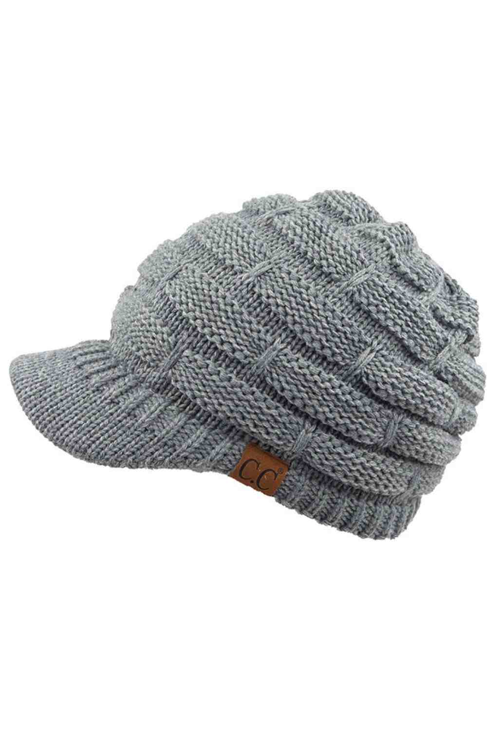 Light Grey The C.C Ribbed Knit Brim Beanie combines comfort and style in one versatile piece. Made from 100% acrylic, this lightweight beanie features a classic ribbed knit construction with a structured brim for added warmth and coverage. Perfect for casual outings or outdoor activities, it pairs effortlessly with any winter wardrobe.