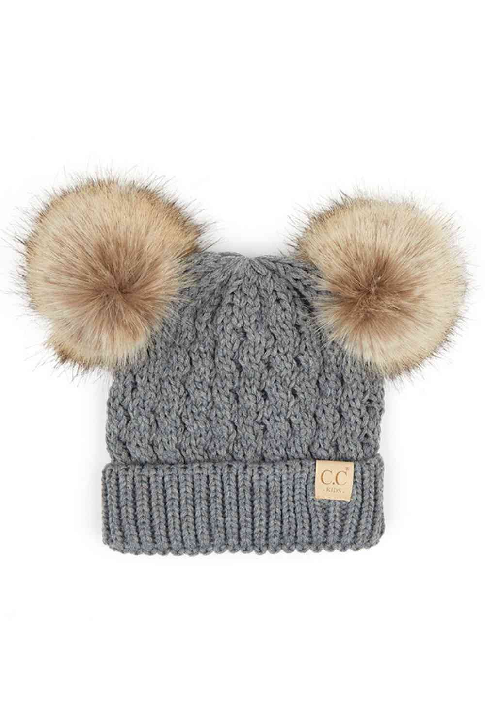 Light Grey Keep your child warm and stylish with this C.C Kids Double Pom Pom Beanie. Featuring an all-over cable knit pattern and dual pom poms for extra charm, it's the perfect accessory for chilly days.