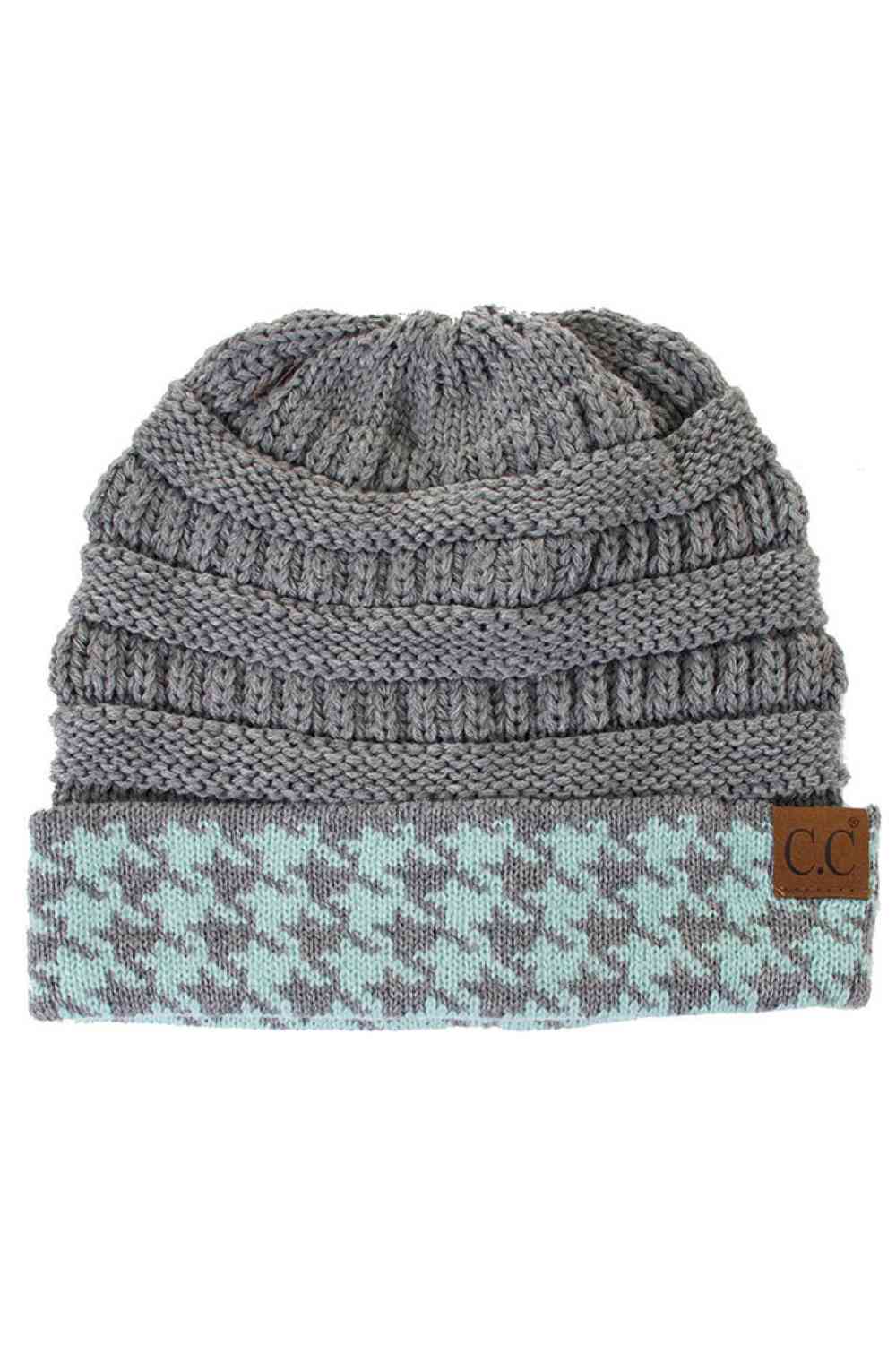 Light Grey Stay warm and stylish with the C.C Houndtooth Cuff Beanie, crafted from 100% acrylic for softness and durability. The classic houndtooth pattern on the cuff adds a timeless touch to your winter look, while the stretchy knit ensures a comfortable fit all day long. A versatile essential for any season.