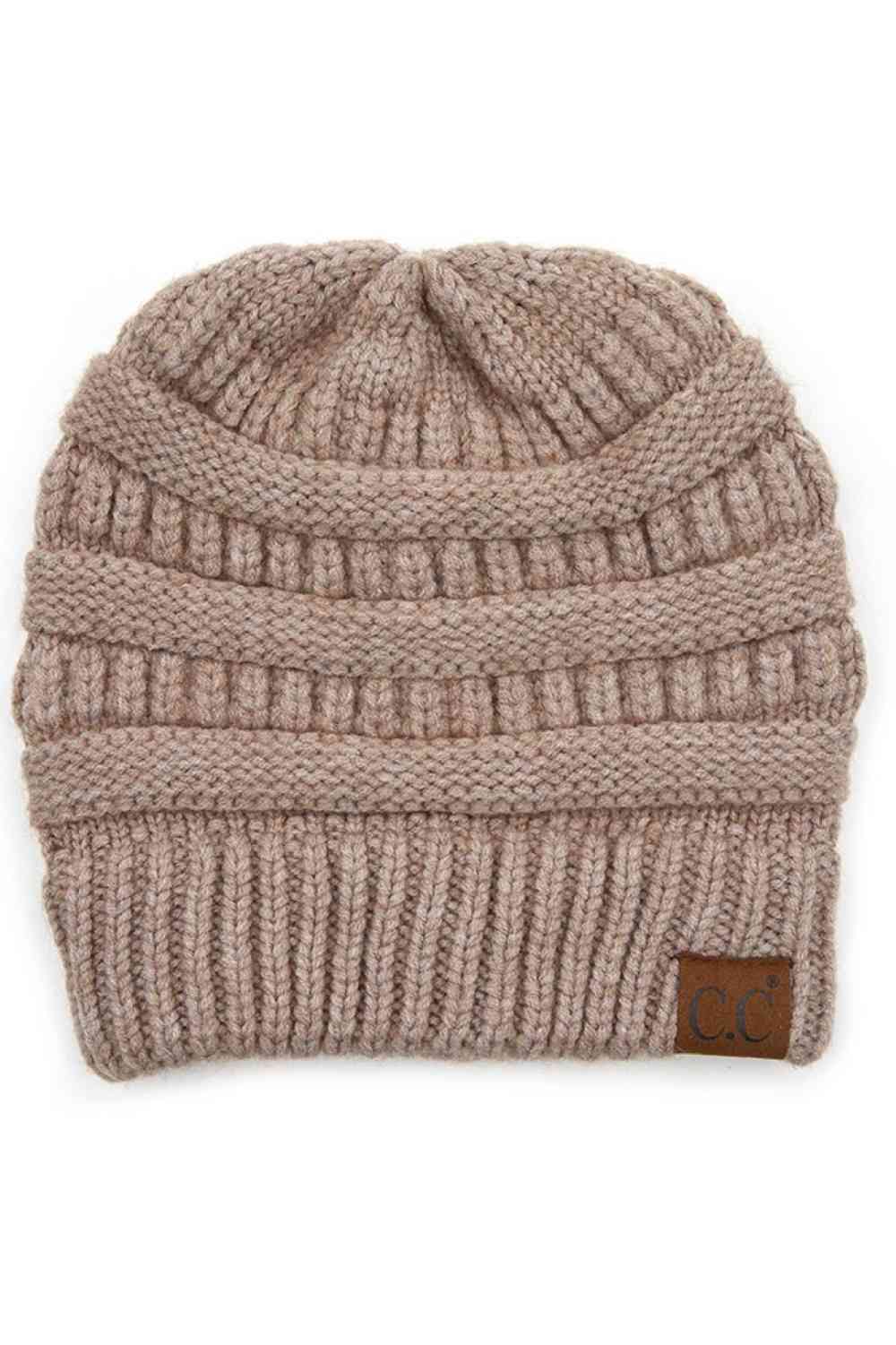 Light Taupe Wrap yourself in softness with this C.C Soft Yarn Knit Beanie, crafted from a premium blend of 47% rayon, 31% PBT, and 22% nylon. The luxurious rayon provides a silky feel against your skin, while the durable synthetic fibers ensure lasting wear through winter season.
