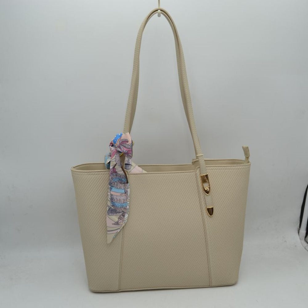 Light Taupe Bring a touch of effortless resort-chic into your daily routine with this stunning cream and cognac shoulder tote. Designed with an elegant chevron-textured weave and beautifully contrasted by rich, warm tan accents, this bag is the ultimate fusion of classic sophistication and everyday practicality. Perfect for office styling, weekend getaways, or casual city strolls, it arrives detailed with a colorful, artistic silk-style scarf playfully tied to the handle for an immediate touch of luxury.