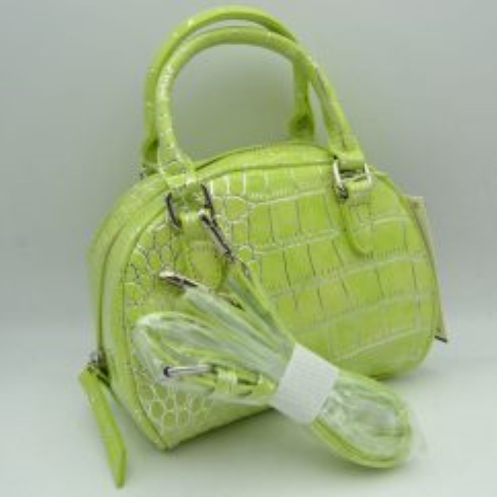 Lime This stylish dome satchel features a structured silhouette w/ a distinct embossed tile-like pattern, making it an excellent accessory for everyday use. Designed w/ a secure top zipper closure equipped w/ an extended pull tab, it opens to a main compartment perfect for keeping daily essentials protected. Dual rolled top handles offer a comfortable grip for handheld carrying, while an included detachable shoulder strap connects easily w/ metallic clasps to provide versatile hands-free carrying options.