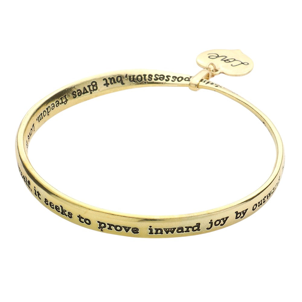 Gold  Love Heart Message Bangle Bracelet is a stunning piece that carries a heartfelt message. Expertly crafted with precision and care, this bracelet makes a perfect gift for someone special. Show your love and affection with this elegant and meaningful accessory. 