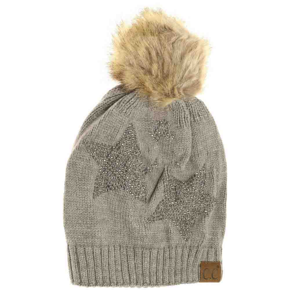 Lt.Grey Rhinestone Star Fur Pom CC Beanie offers a sophisticated blend of functionality and style. Crafted with high-quality knit fabric, it provides exceptional warmth and comfort during colder months. The distinctive rhinestone star embellishment adds a subtle sparkle, while the soft fur pom delivers a fashionable yet cozy finish. Ideal for elevating everyday winter ensembles, this beanie strikes a perfect balance between practicality and a refined aesthetic. 