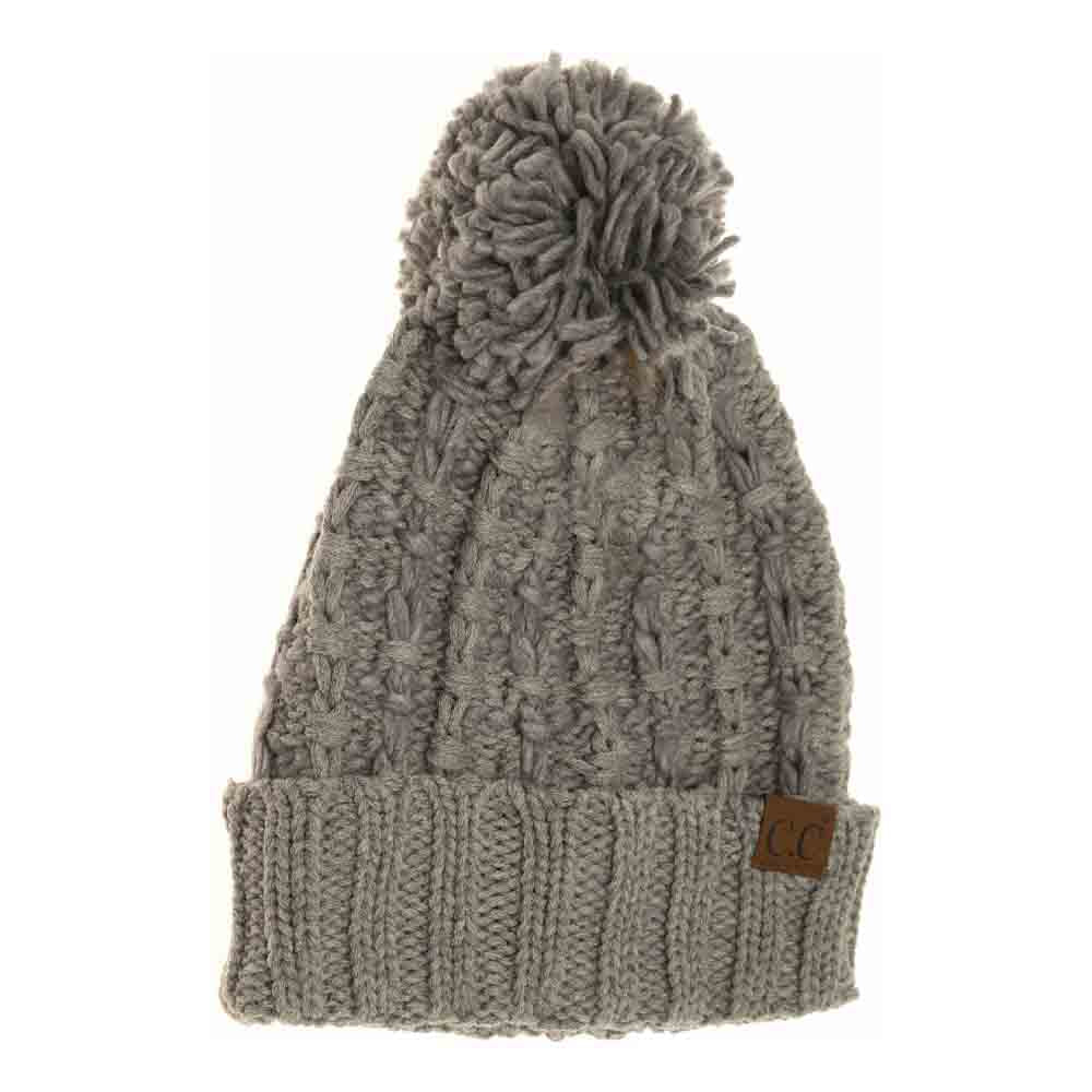 Lt.Grey Slipstitch Pom Beanie expertly blends functional warmth with refined design. Crafted with a textured slipstitch knit, it ensures durability and a snug fit while maintaining breathability. The added pom offers a subtle yet distinctive accent, making this beanie an essential piece for both outdoor protection and polished winter style. 