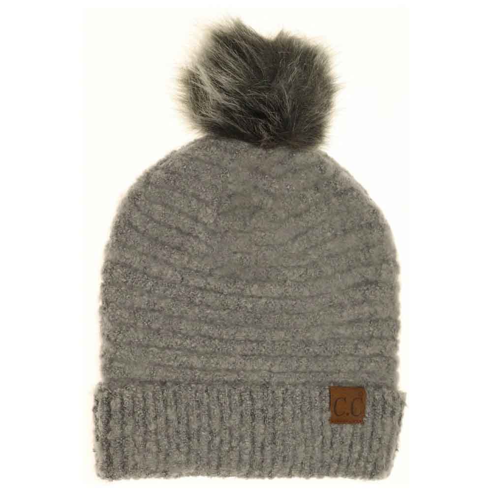  Lt. Grey Solid Boucle Knit Pom CC Beanie combines texture and warmth through its soft boucle knit fabric. Designed for expert-level comfort, this beanie features a classic silhouette topped with a playful pom for a refined yet casual look. Ideal for cold weather, it offers durable insulation while maintaining breathability, making it a versatile accessory for everyday wear. 