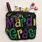 Multi Eye-catching zipper pouch featuring bold Mardi Gras lettering with intricate beadwork, designed for storing cosmetics, accessories, or small essentials. A festive statement accessory ideal for seasonal assortments, gift shops, and boutique displays, offering playful style, strong shelf appeal, and everyday functionality for celebration-focused retail collections.