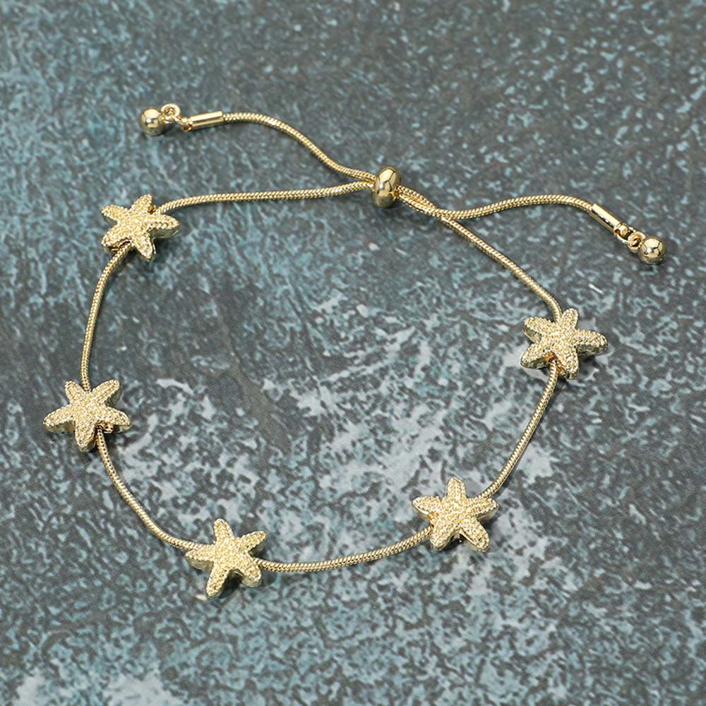 Madeline Love Gold Textured Metal Starfish Station Cinch Pull Tie Bracelet - Bracelets