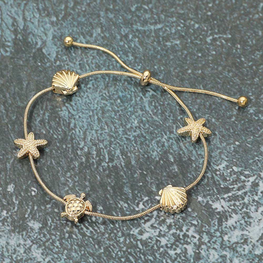 Madeline Love Gold Textured Metal Starfish Shell Turtle Station Cinch Pull Tie Bracelet - Bracelets