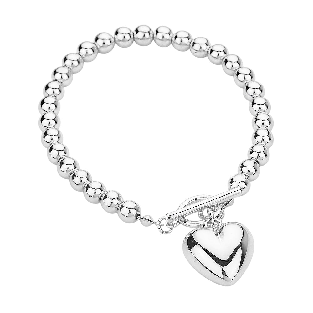 Metal Heart Charm Bubble Chain Toggle Bracelet is the perfect accessory for any outfit. The metal heart charm adds a touch of elegance, while the unique bubble chain and toggle closure provide a secure fit. Made with high-quality materials, this bracelet is both fashionable and functional, making it a must-have for any fashion-forward individual.