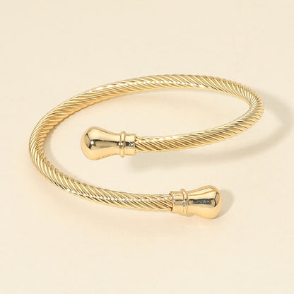 Madeline Love Gold Twisted Metal Cable Bangle Bracelet - Bracelets