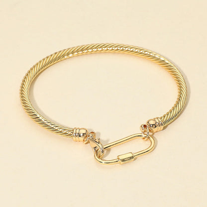 Madeline Love Gold Carabiner Accent Twisted Cable Bangle Bracelet - Bracelets