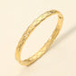 Madeline Love Gold Stainless Steel Crisscross Textured Hinged Bangle Bracelet - Bracelets