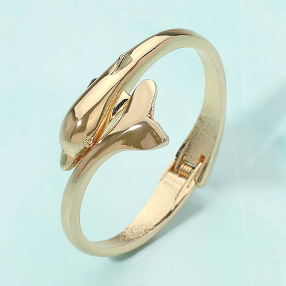 Madeline Love Gold Sleek Dolphin Hinged Bangle Bracelet - Bracelets