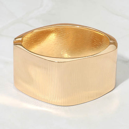 Madeline Love Gold Bold Ribbed Metal Hinged Bangle Bracelet - Bracelets