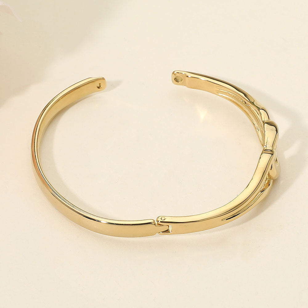 Madeline Love Gold Stainless Steel Twist Link Hinged Bangle Bracelet - Bracelets - extra