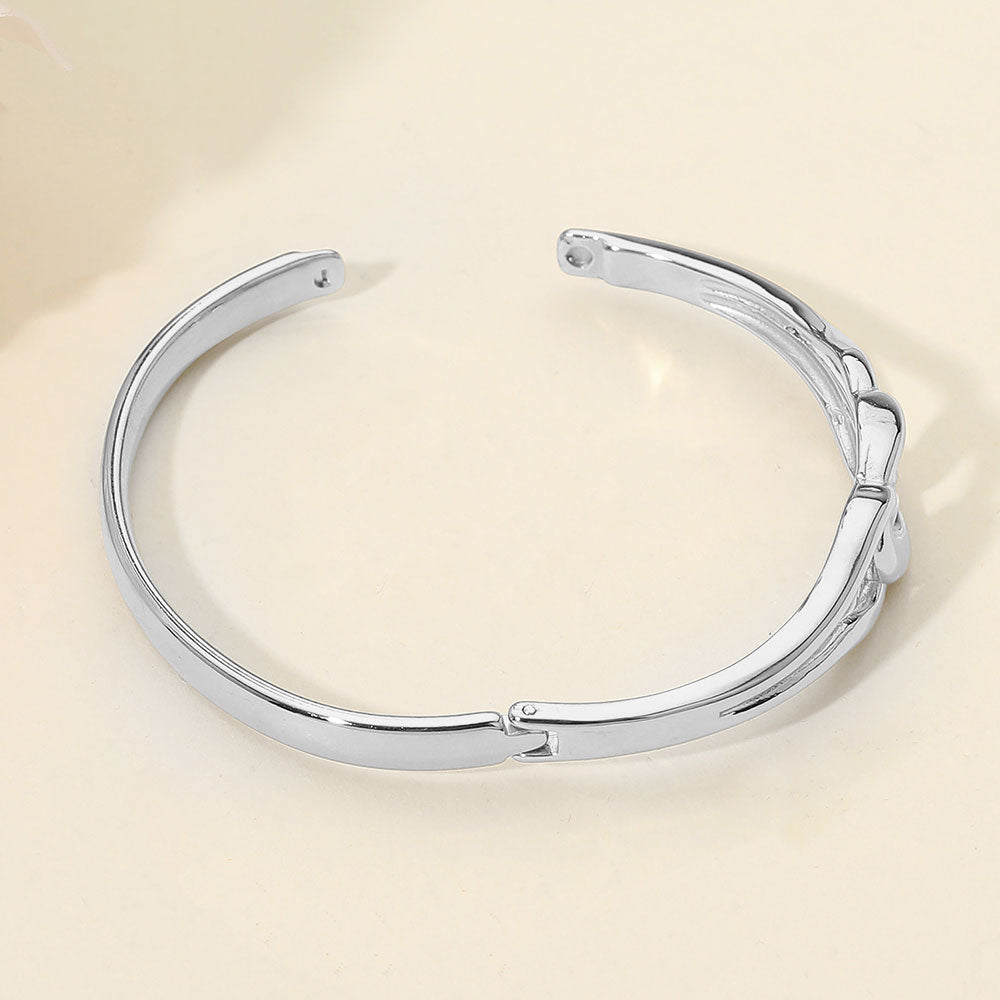 Madeline Love Silver Stainless Steel Twist Link Hinged Bangle Bracelet - Bracelets - extra