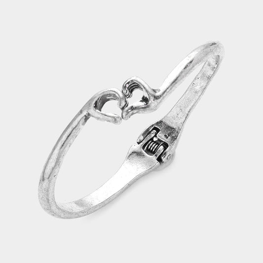 Madeline Love Silver Burnished Metal Heart Hands Hinged Bangle Bracelet - Bracelets