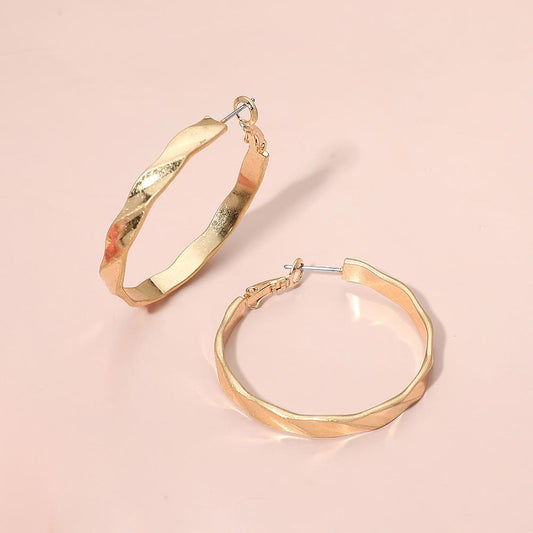 Madeline Love Worn Gold Twisted Metal Hoop Earrings