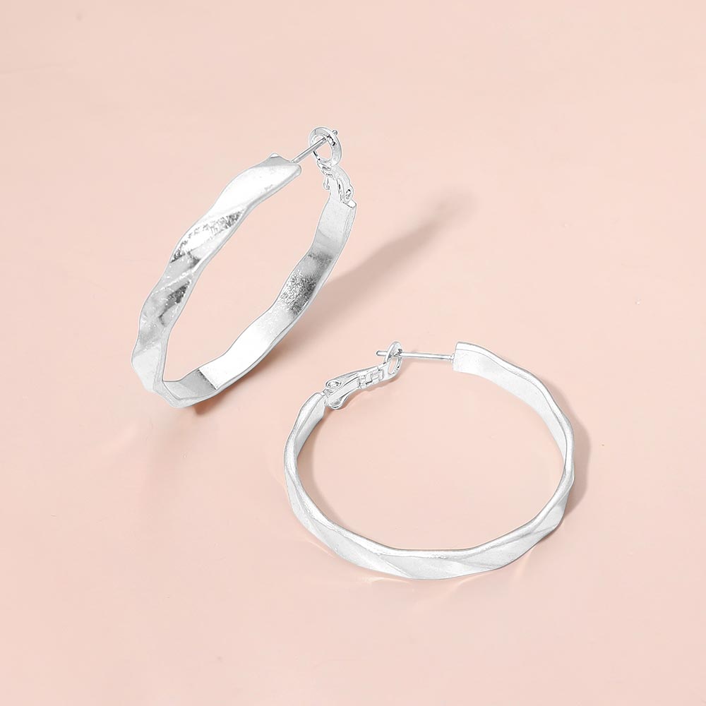 Madeline Love Worn Silver Twisted Metal Hoop Earrings