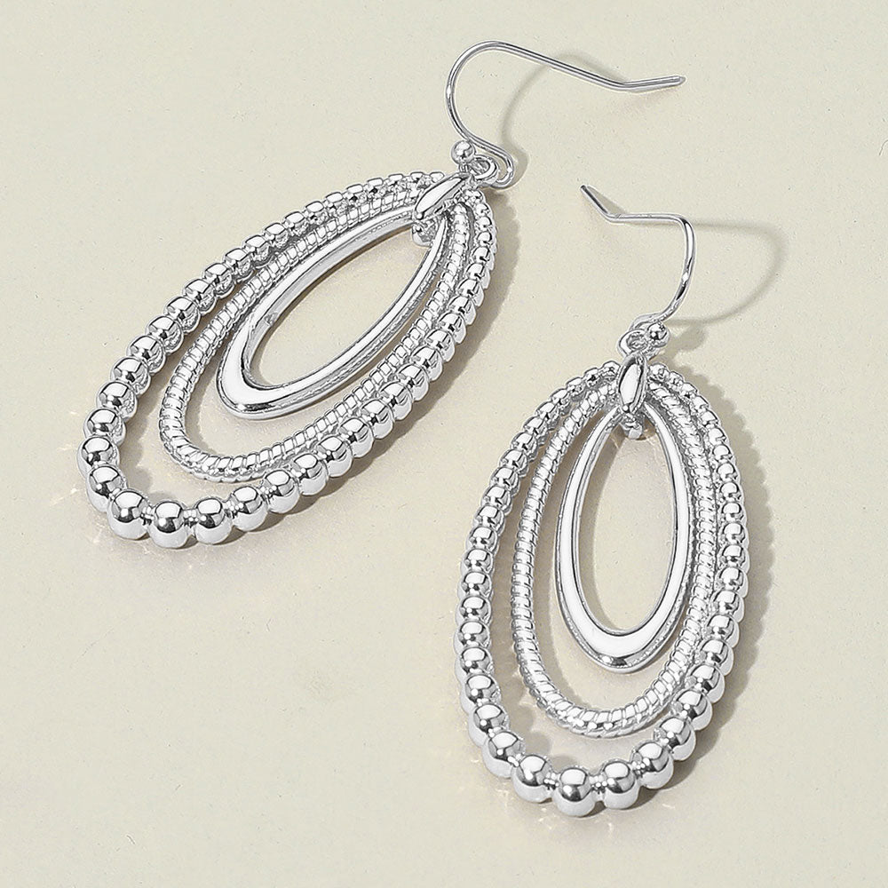 Madeline Love Rhodium Textured Bead Layered Oval Dangle Earrings