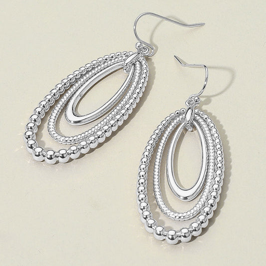 Madeline Love Rhodium Textured Bead Layered Oval Dangle Earrings