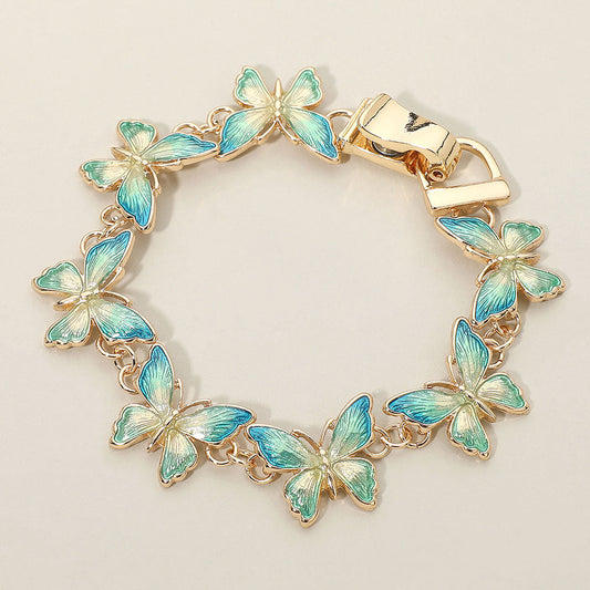 Madeline Love Blue, Gold Butterfly Link Magnetic Bracelet - Bracelets