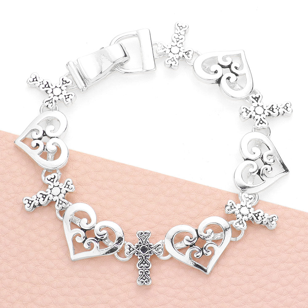 Silver Burnished Filigree Heart Cross Link Magnetic Bracelet adds elegance to any outfit. Its detailed design has magnetic clasps for easy wear and is sure to stand out. Made with high-quality materials, this bracelet is both stylish and practical. Feel confident and fashionable with this must-have accessory.