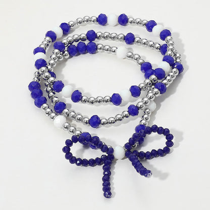 Madeline Love Blue, Rhodium, White 3PCS - Sports Team Theme Colored Bow Accent Faceted Beaded Stretch Multi Layered Bracelets
