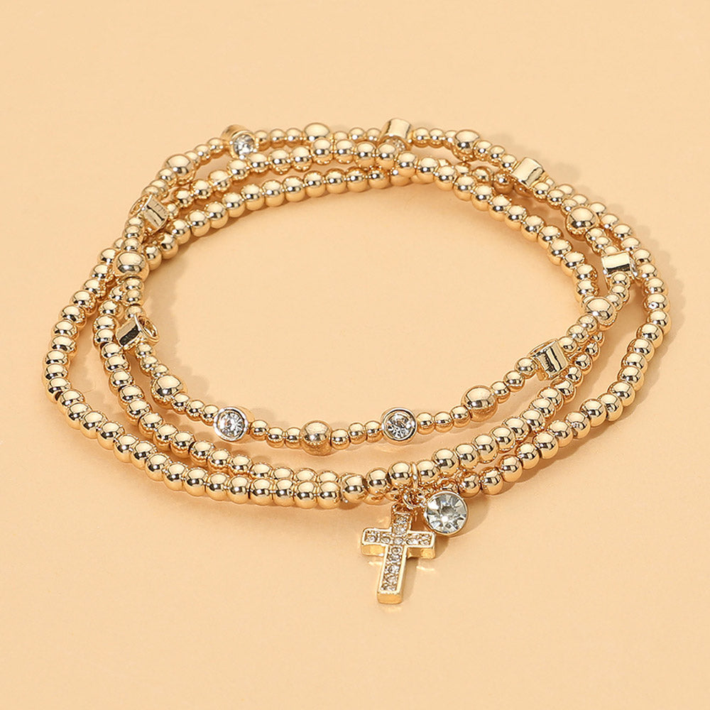 Madeline Love Clear, Gold Round Rhinestone Cross Charm Beaded Stretch Multi Layered Bracelets
