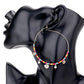 Multi Rhinestone Embellished Metal Heart Beaded Open Circle Earrings add a touch of elegance to any outfit. With intricate rhinestone details and a unique open circle design, these earrings are perfect for any occasion. Made with high-quality materials, these earrings are both stylish and durable. Upgrade your accessory game with these stunning earrings.