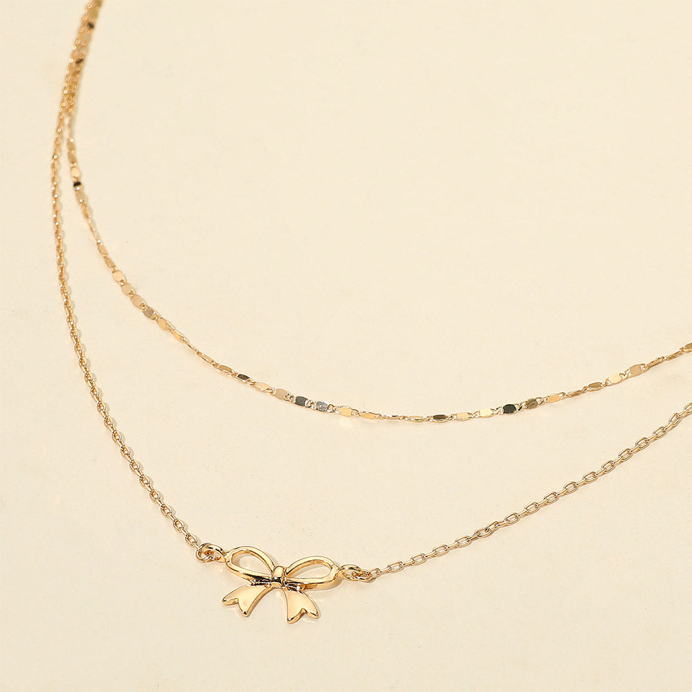 Madeline Love Gold Metal Bow Pendant Accent Layered Chain Necklace - Necklaces