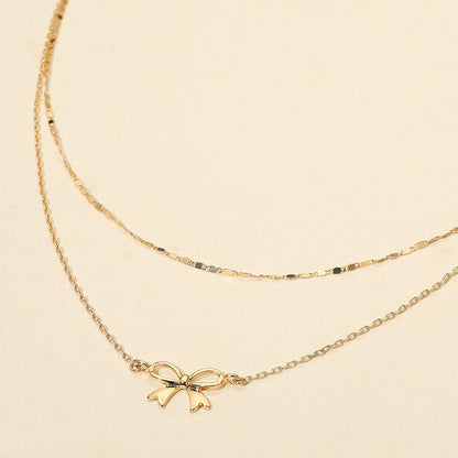 Madeline Love Gold Metal Bow Pendant Accent Layered Chain Necklace - Necklaces
