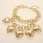 Madeline Love Gold Bold Puffy Metal Heart Charm Station Linked Chain Layered Statement Necklace - Necklaces